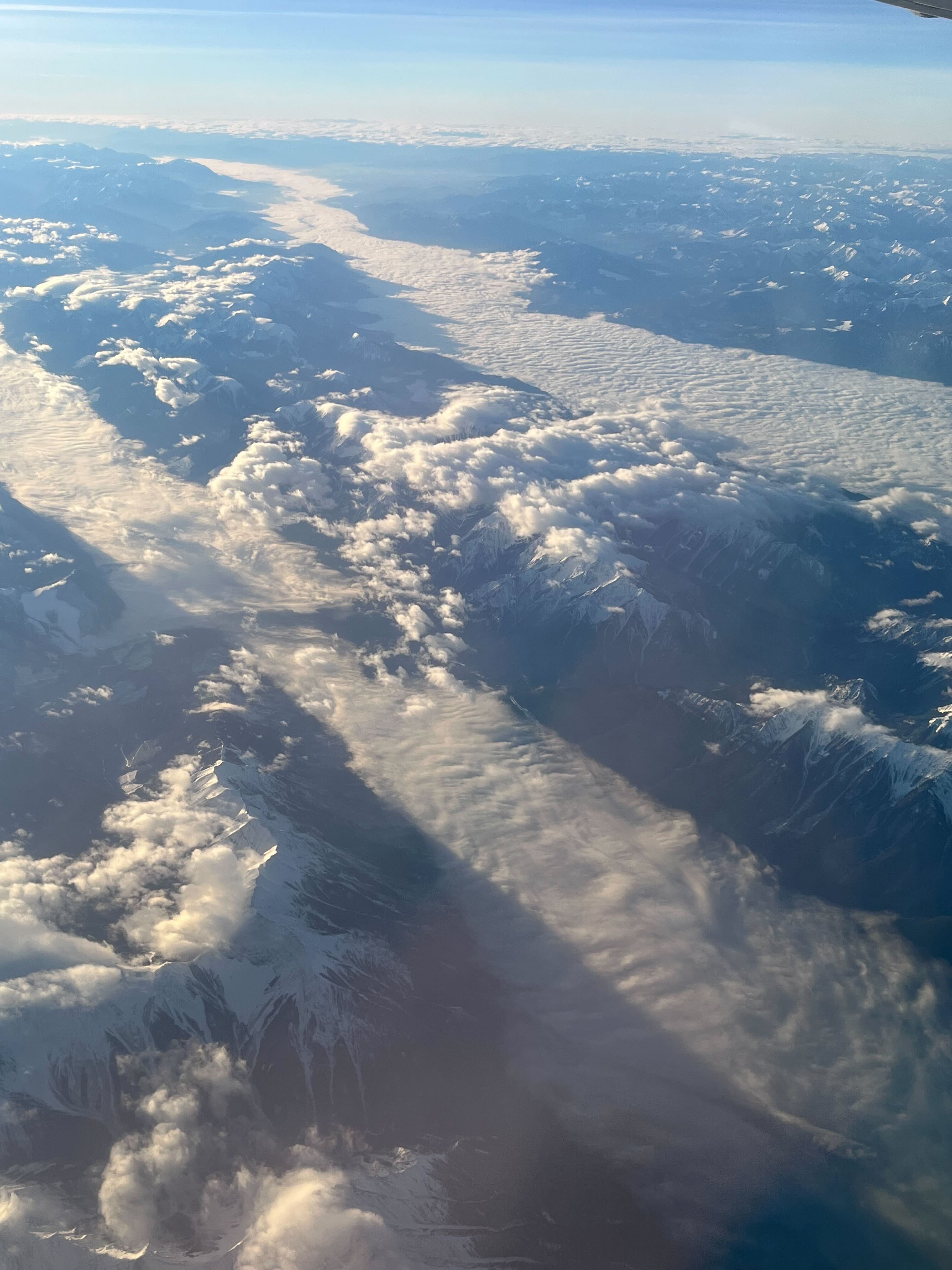 photo from airplane of valley low cloud or fog