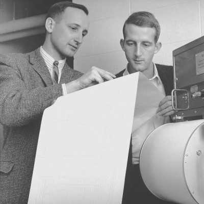 Bob (left) and a colleague examining a seismogram in his early days in the Department of Geophysics and Astronomy